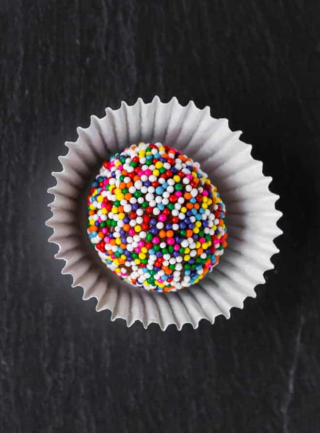 Image of a fudge ball, coated in colorful sprinkles.