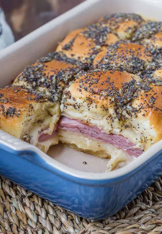 Image of sliders with ham and cheese in a baking dish.