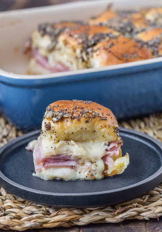 Image of messy slider with ham and cheese.