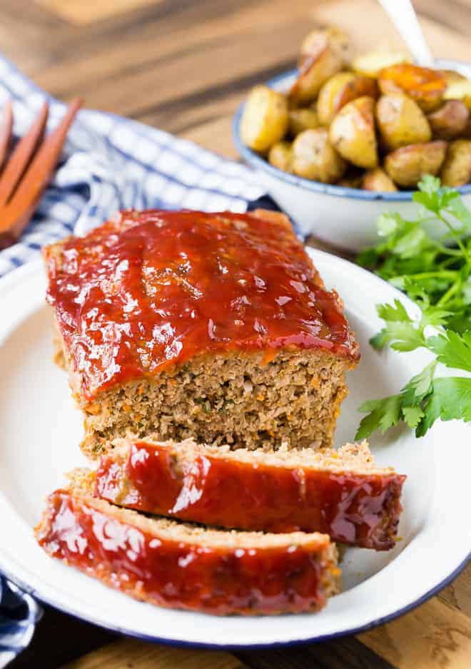 Image of turkey, pork, and beef meatloaf with a shiny tomato based glaze.