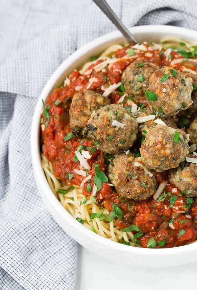 Image of meatballs in a bowl with spaghetti and sauce.