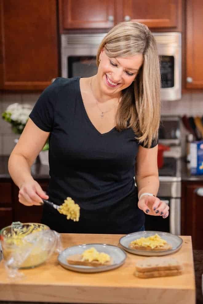 Image of Rachel Gurk making an egg salad sandwich in her kitchen.