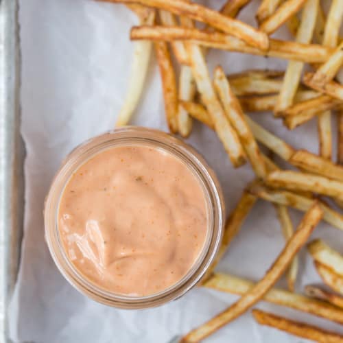 Image of french fries with delicious light-orange fry sauce made with mayonnaise, ketchup, mustard, relish, and apple cider vinegar.