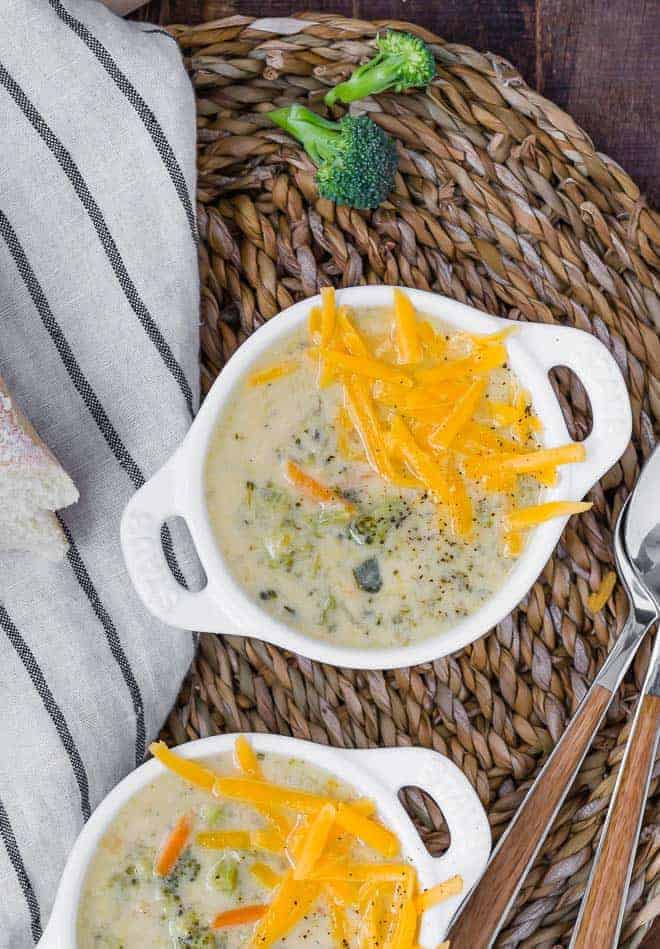 Image of pressure cooker broccoli cheddar soup in white bowls.