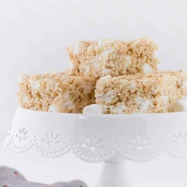 Image of a cake stand topped with a stack of rice krispie treats.