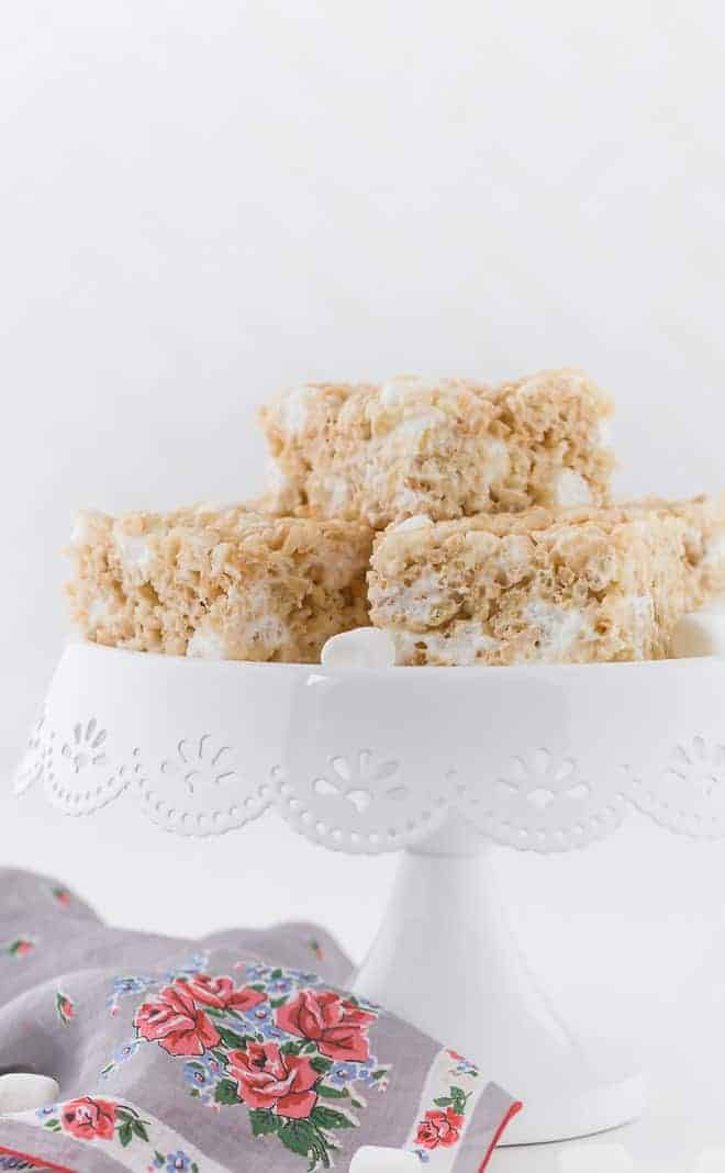 Image of a cake stand topped with a stack of rice krispie treats.