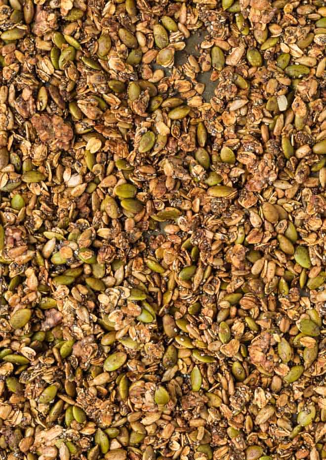 Close up image of nut-free granola made with sunflower seeds, pepitas, oats, and chia seeds.
