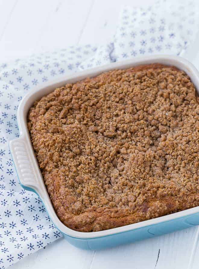 Image of unsliced coffee cake in a blue baking dish.