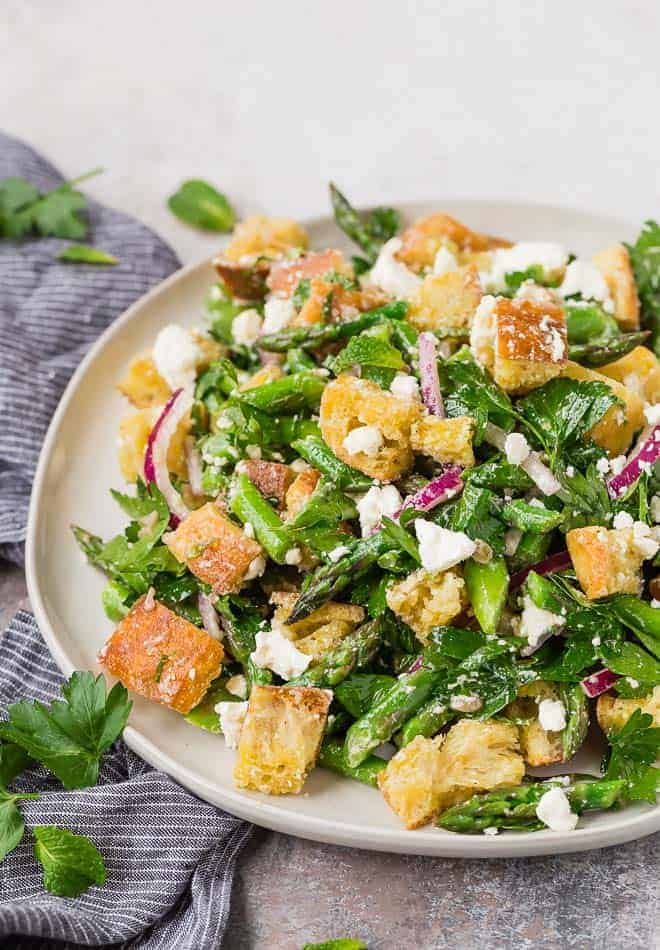 Image of a springtime panzanella salad made with asparagus.