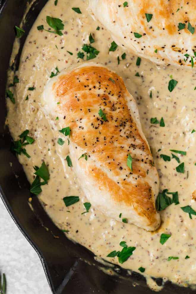 Image of browned chicken in a creamy dijon sauce. 