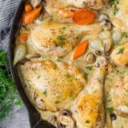 Image of chicken fricassee in a black skillet.