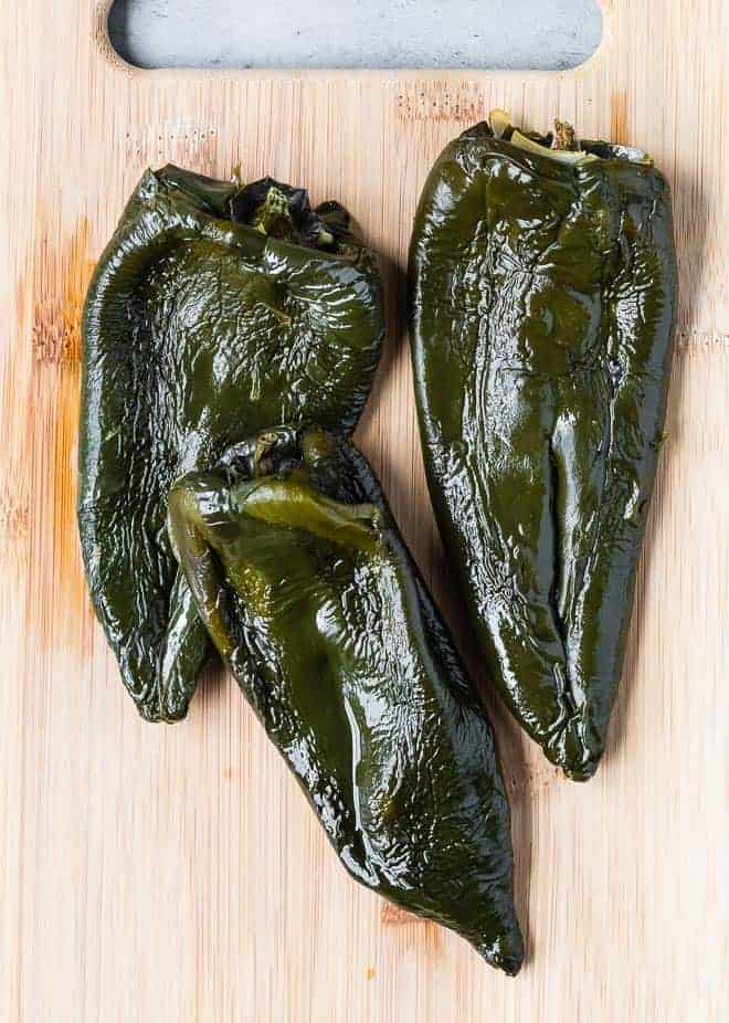 Image of roasted poblano peppers that have been peeled.