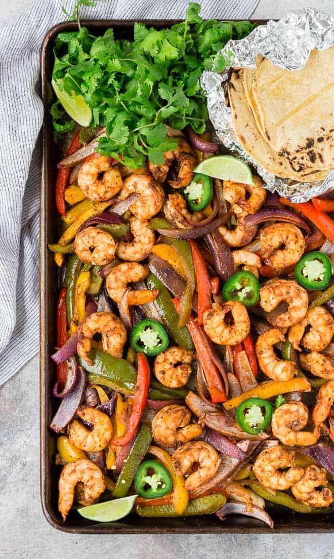 Shrimp fajitas on a sheet pan.