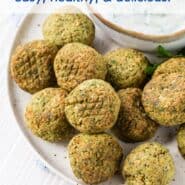 Overhead view of falafel, tzatziki, and fresh parsley, with a text overlay that reads "air fryer falafel, easy, healthy, & delicious"