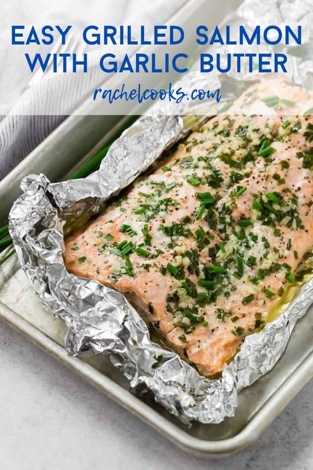 Salmon in a foil wrap, with a text overlay that reads "easy grilled salmon with garlic butter."