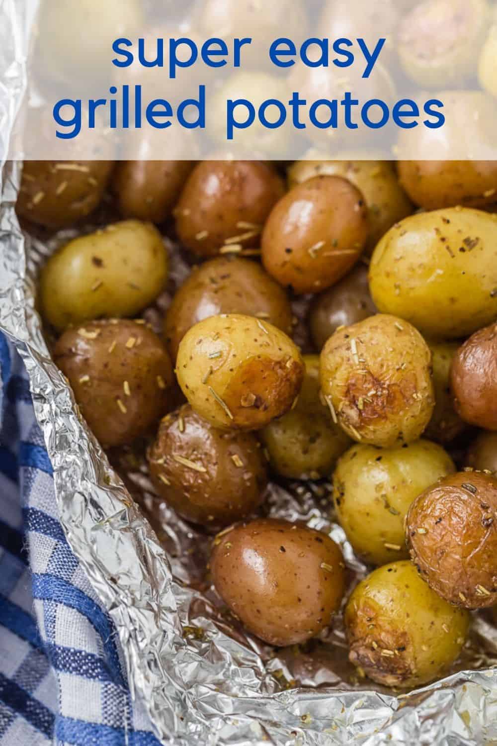 Baby potatoes with rosemary, wrapped in foil. A text overlay reads "super easy grilled rosemary potatoes"