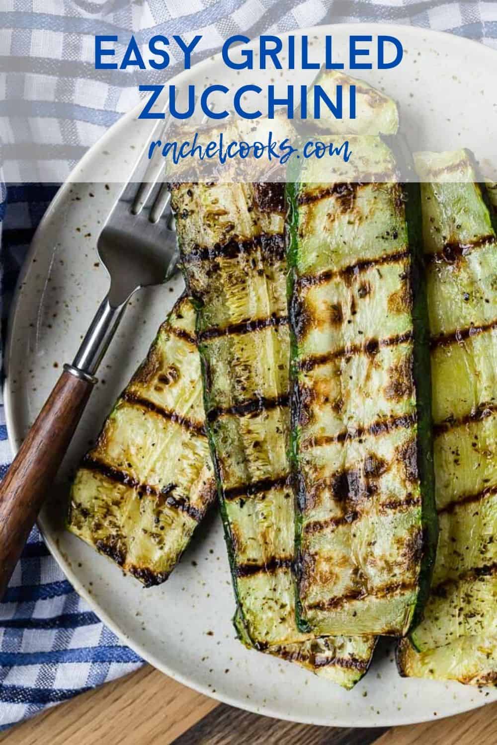 Overhead view of stacked up slices of grilled zucchini.