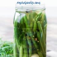 Jar of green beans in pickling liquid, with a text overlay.
