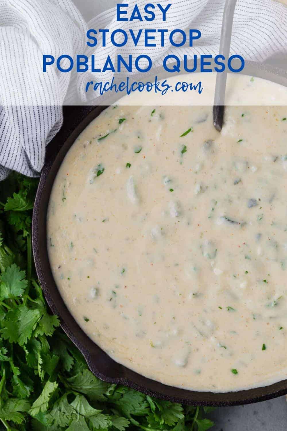 Overhead view of queso in a black pan surrounded by fresh cilantro.