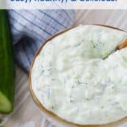 A bowl of creamy yogurt sauce with a spoon inserted, with a overlay that reads "homemade tzatziki, easy, healthy & delicious!"