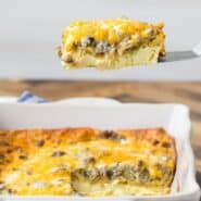 Slice of breakfast casserole being lifted out of a pan, with a text overlay naming the recipe.