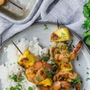 Shrimp kabobs with pineapple. Text overlay reads "grilled shrimp and pineapple kabobs."