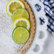 Lemon lime tart with text overlay.