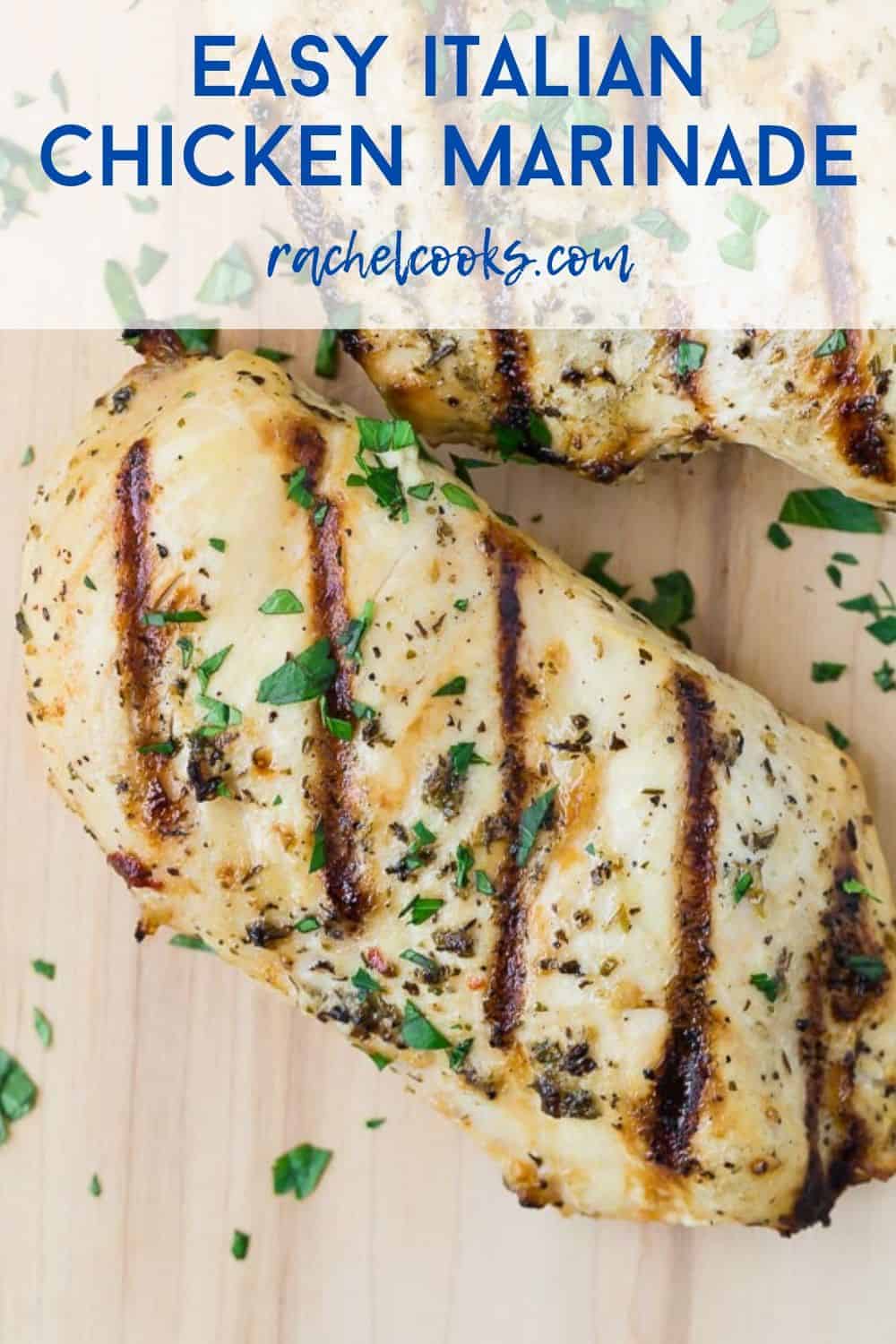 Grilled chicken breasts on a wooden cutting board. Text overlay reads "Easy Italian Chicken Marinade - rachelcooks.com"