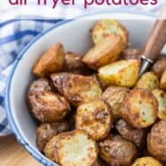 Air fried potatoes in a blue and white bowl. Text overlay reads "the crispiest air fryer potatoes"