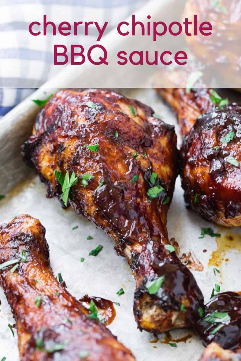 BBQ chicken drumsticks with a text overlay that reads "cherry chipotle bbq sauce."
