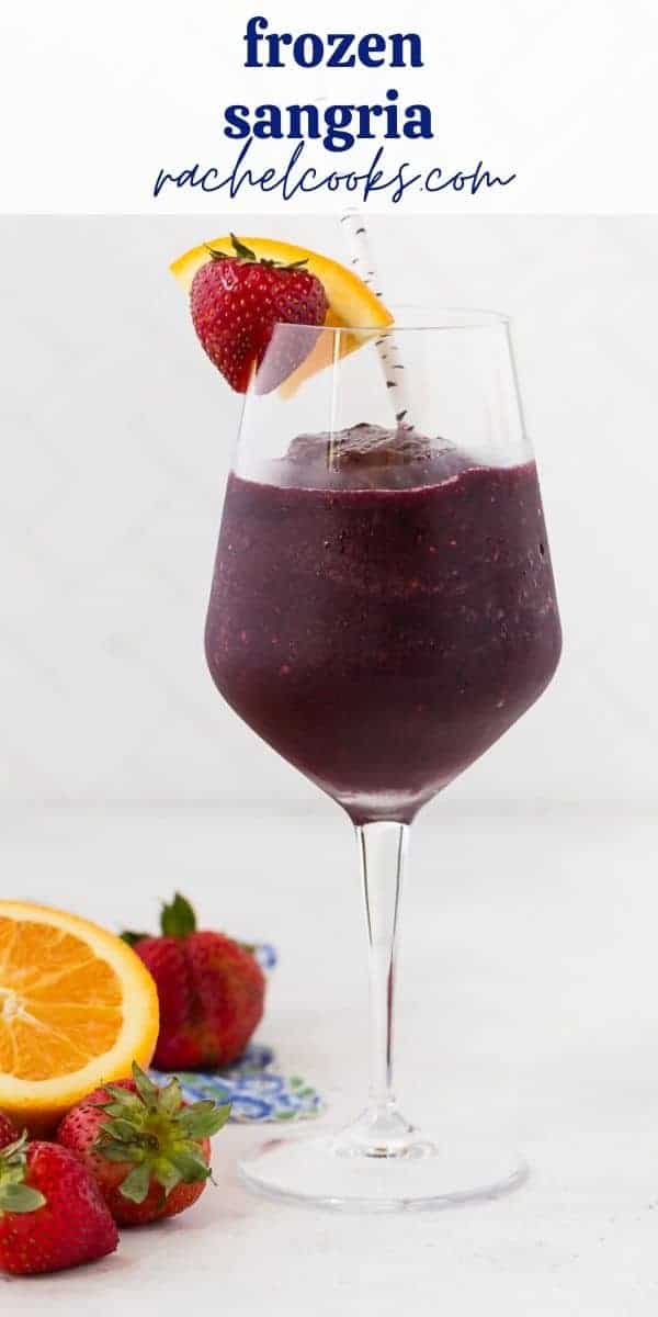 Tall stemmed glass of a dark red frozen beverage. Text overlay reads "frozen sangria."