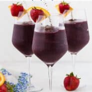 Three glasses of a dark red frozen beverage. Text overlay reads "frozen sangria."