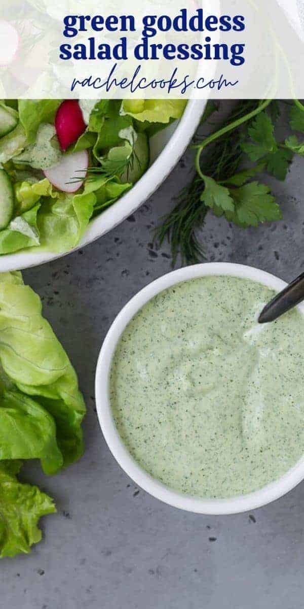 Green and white salad dressing in a white bowl with a black spoon. Text overlay reads "green goddess salad dressing."