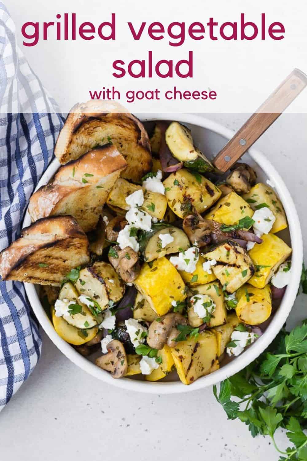 Overhead view of a warm vegetable salad, text overlay rads "grilled vegetable salad with goat cheese."