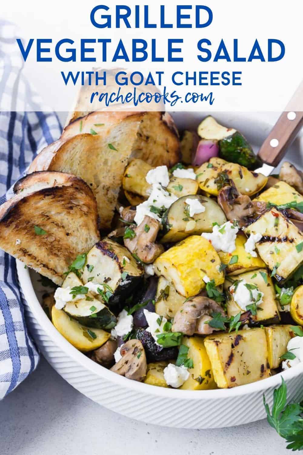 A white bowl filled with a warm vegetable salad, text overlay rads "grilled vegetable salad with goat cheese."
