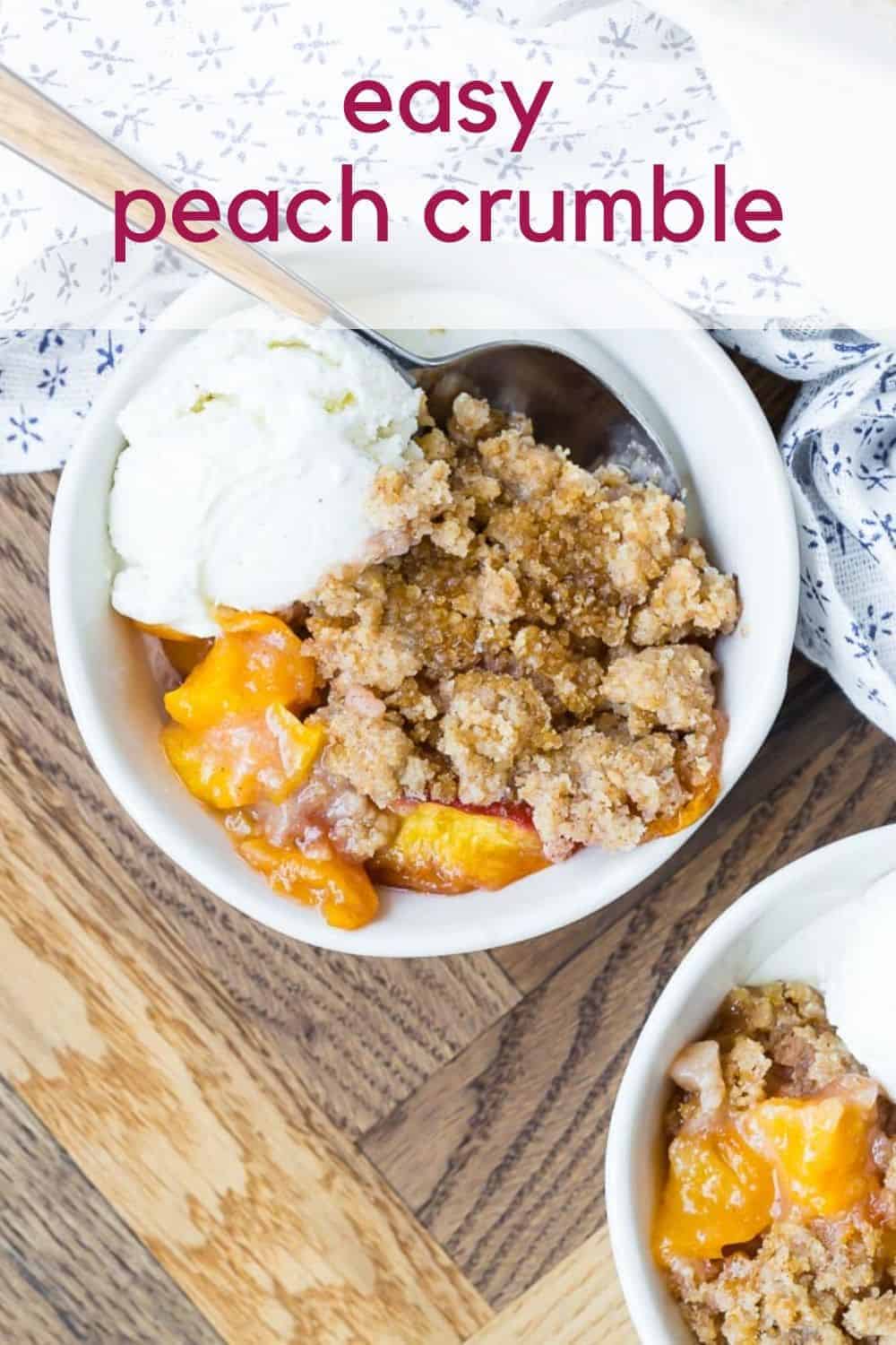 Overhead view of plated peach dessert, with ice cream. Text overlay reads "easy peach crumble."