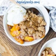 Overhead view of plated peach dessert, with ice cream. Text overlay reads "the most amazing peach crumble."