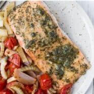 Overhead view of sheet pan dinner with text overlay that reads "sheet pan salmon with tomatoes and fennel - rachelcooks.com"