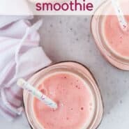 Overhead view of a pink fruit smoothie with fun sprinkles straws.