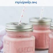 Pink fruit smoothies in small glass jars with a text overlay that reads "tropical fruit smoothie - make it your own!"