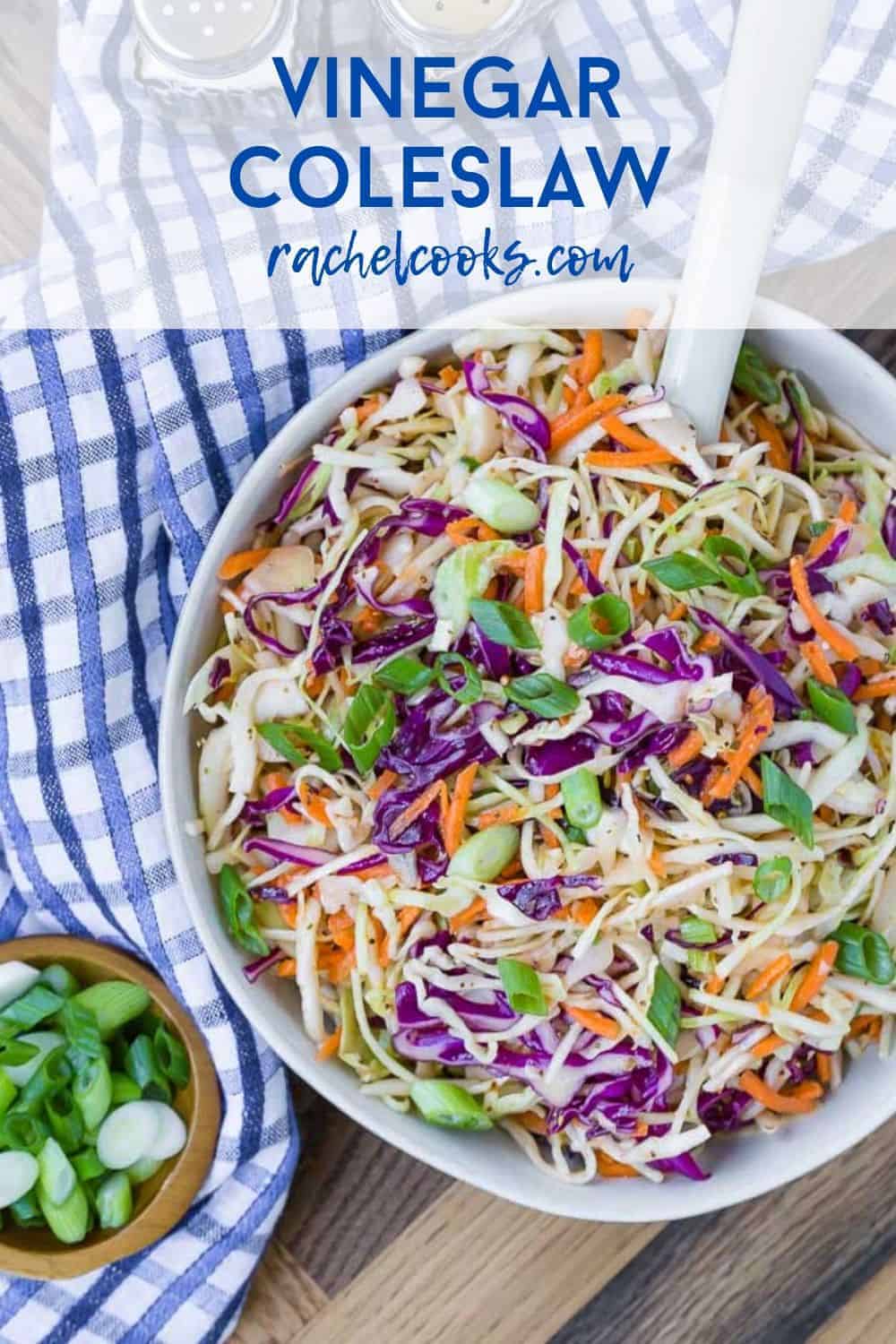 Colorful coleslaw in a white bowl with a blue and white linen. Text overlay reads "vinegar coleslaw - rachelcooks.com"