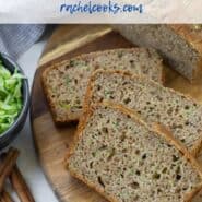 Overhead view of sliced zucchini bread. A text overlay reads "whole wheat zucchini bread - rachelcooks.com"