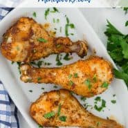 Chicken legs on a white plate, text overlay reads "easy air fryer chicken drumsticks - rachelcooks.com"