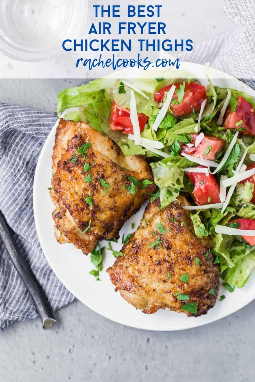 Two chicken thighs on a plate with salad, text overlay reads "the best air fryer chicken thighs, www.rachelcooks.com"