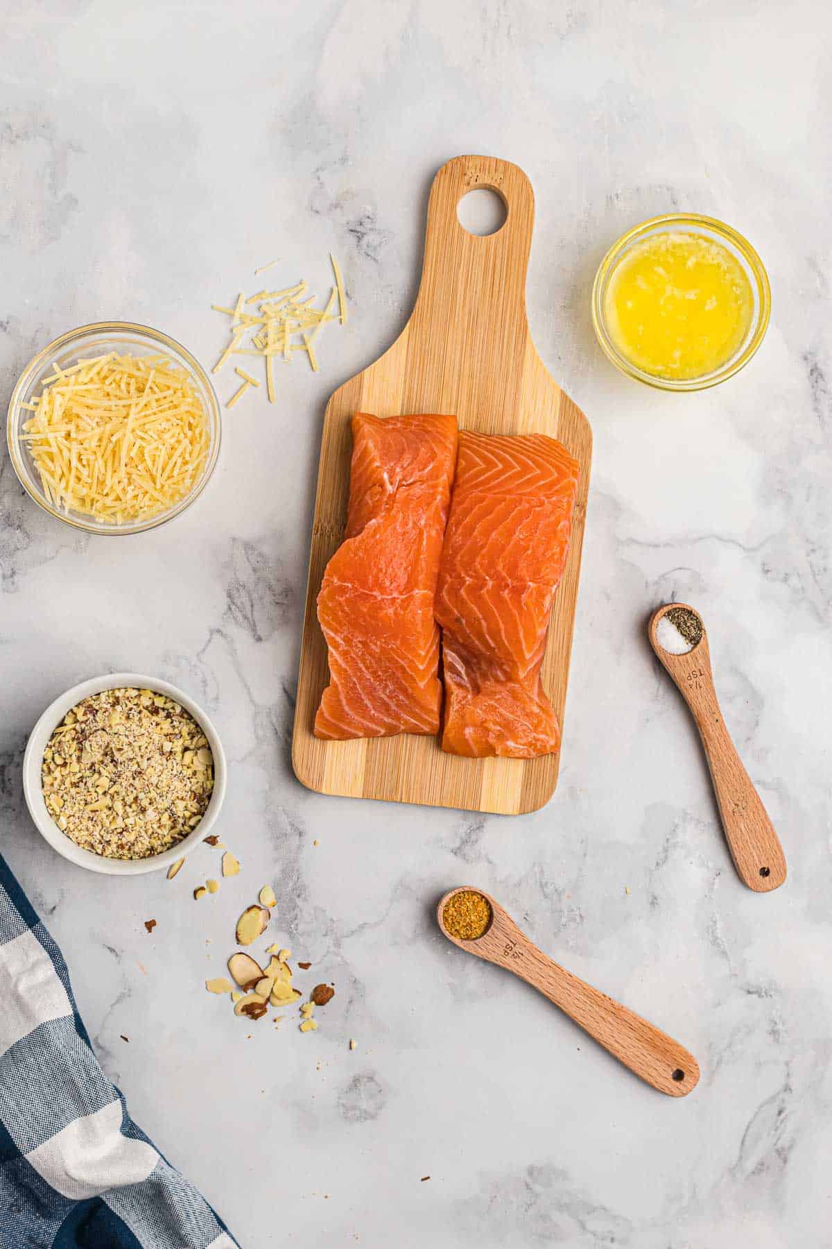 Overhead view of ingredients needed ot make salmon with almonds and parmesan.