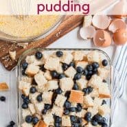 Overhead view of pan of uncooked blueberry bread pudding with text overlay that reads "the easiest blueberry bread pudding"