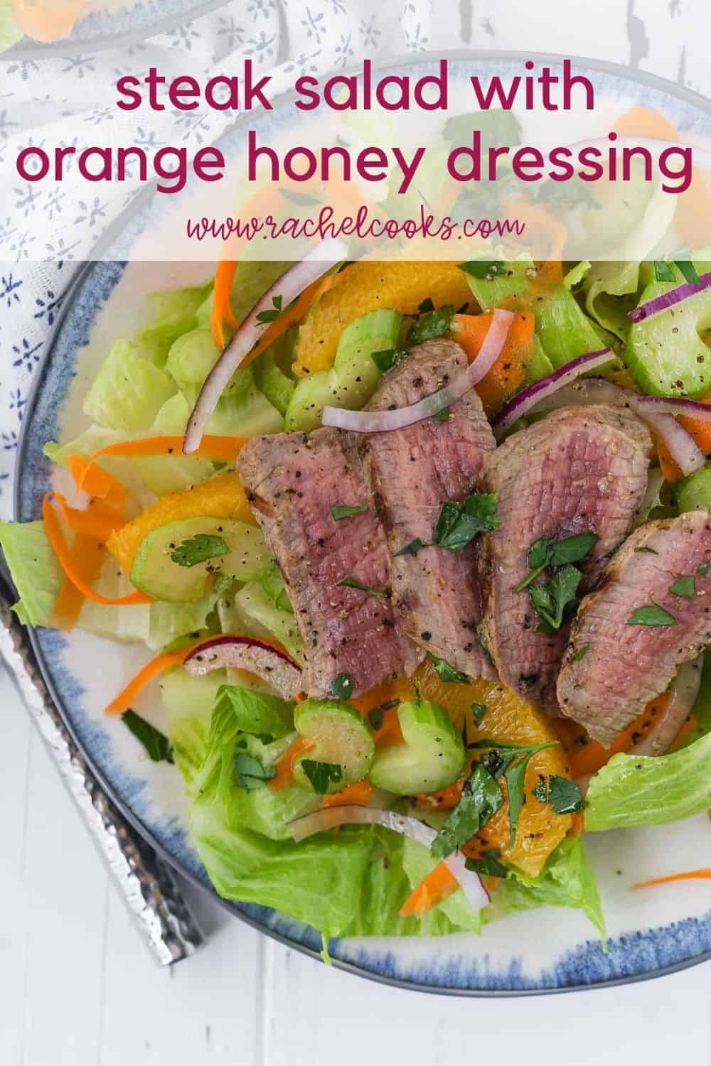 Steak salad with oranges with a text overlay reading "steak salad with orange honey dressing"