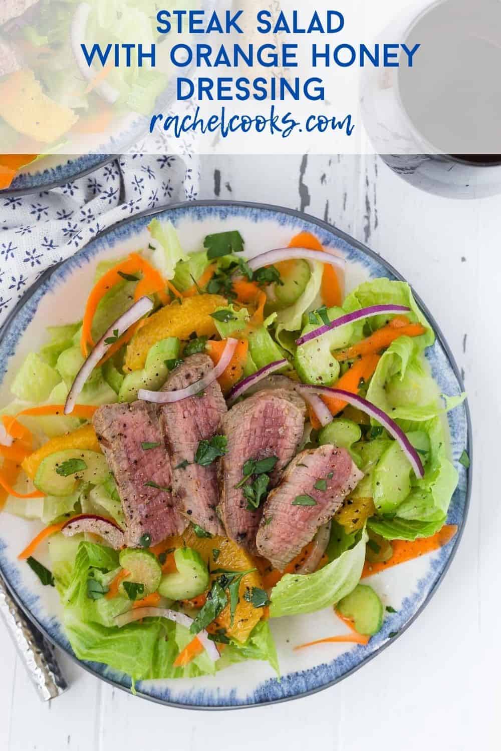 Steak salad with oranges with a text overlay reading "steak salad with orange honey dressing"