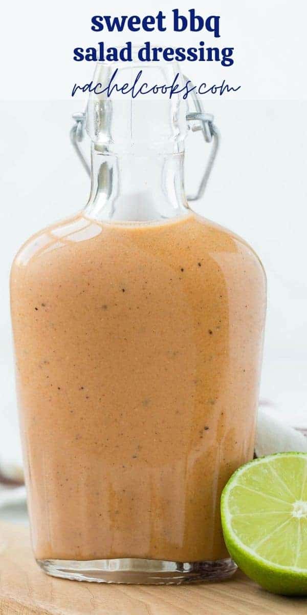 Small glass bottle of sweet bbq salad dressing on a wooden cutting board. Text overlay reads "sweet bbq dressing"
