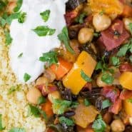 Moroccan stew with chickpeas and squash, served with couscous and yogurt.